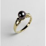 A Tahitian pearl and diamond 14ct gold dress ring, the round cultured pearl approx. 7mm diameter,