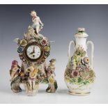 A Sitzendorf porcelain figural mantel clock, 19th century, the rococo shaped clock case