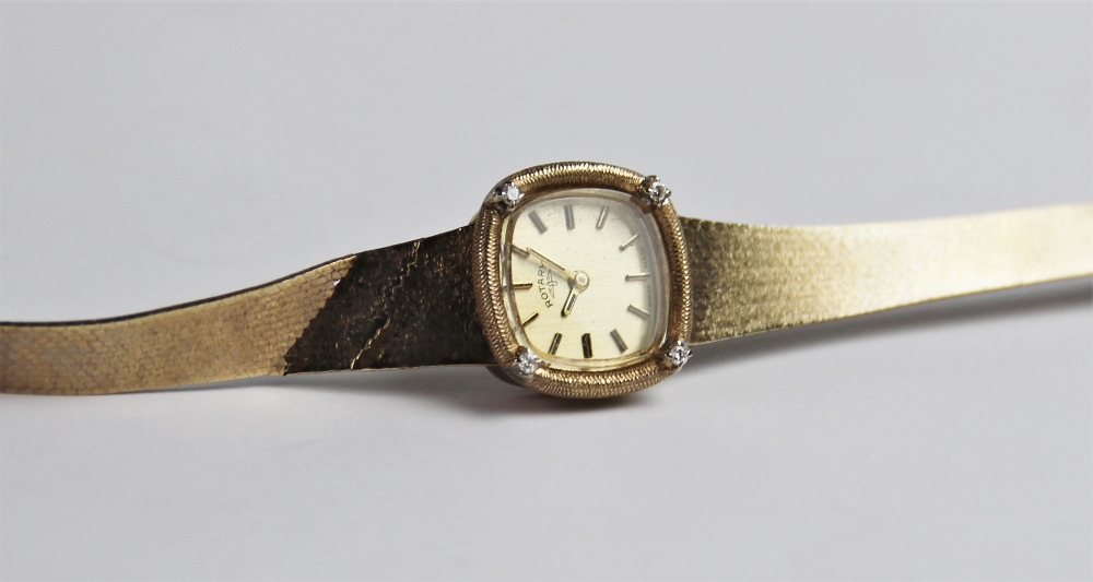 A lady's vintage 9ct gold Rotary wristwatch, the square gold toned dial with baton markers, set to a