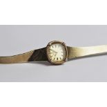 A lady's vintage 9ct gold Rotary wristwatch, the square gold toned dial with baton markers, set to a