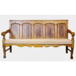 A late 18th century oak, birch and fruitwood settle, the high back with five fielded panels