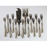A set of twelve continental silver handled fish forks, each weighted handle with engraved