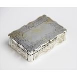 A large Victorian silver snuff box by Edward Smith, Birmingham 1858, of rectangular form with shaped