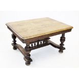 An early 20th century French oak centre table, later reconstructed, the rectangular moulded top with