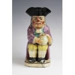 A Victorian Staffordshire pearlware toby jug, probably mid 19th century, the jug of typical form