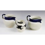 Two Chetham And Woolley feldspathic stoneware sprig moulded hunting jugs, early 19th century, each