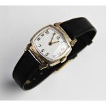 A vintage wristwatch, the white enamel dial with gold toned Arabic numerals and outer seconds track,