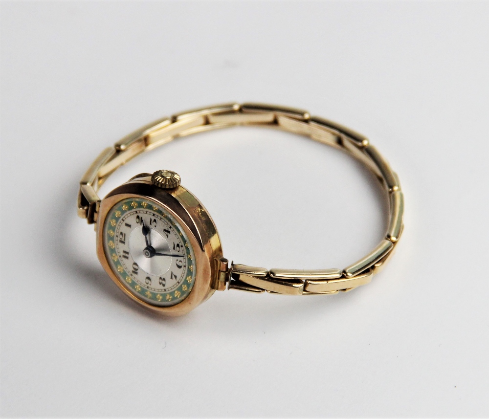 A vintage 9ct gold lady's wristwatch, the round silvered dial with engine turned decoration and - Bild 2 aus 2