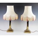 A pair of 19th century style Corinthian column lamp bases, designed in the typical form raised on
