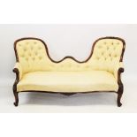 A Victorian rosewood framed double ended chaise longue, the twin arched button back above a