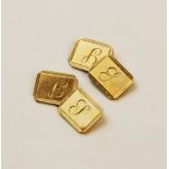 A pair of 9ct gold cufflinks, each of rectangular form with truncated corners, engine turned