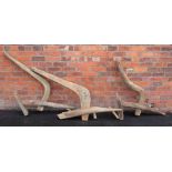Five rustic wooden oxen ploughs, of typical carved form, applied with an iron blade, approx length