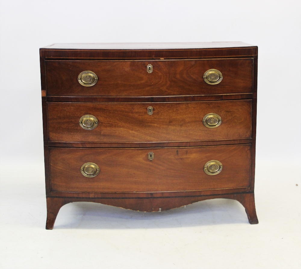 A George III mahogany bow front chest of drawers, the top centred with an inlaid satinwood fan