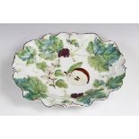 A Chelsea red anchor period vine leaf moulded dish, circa 1752-56, hand painted with polychrome