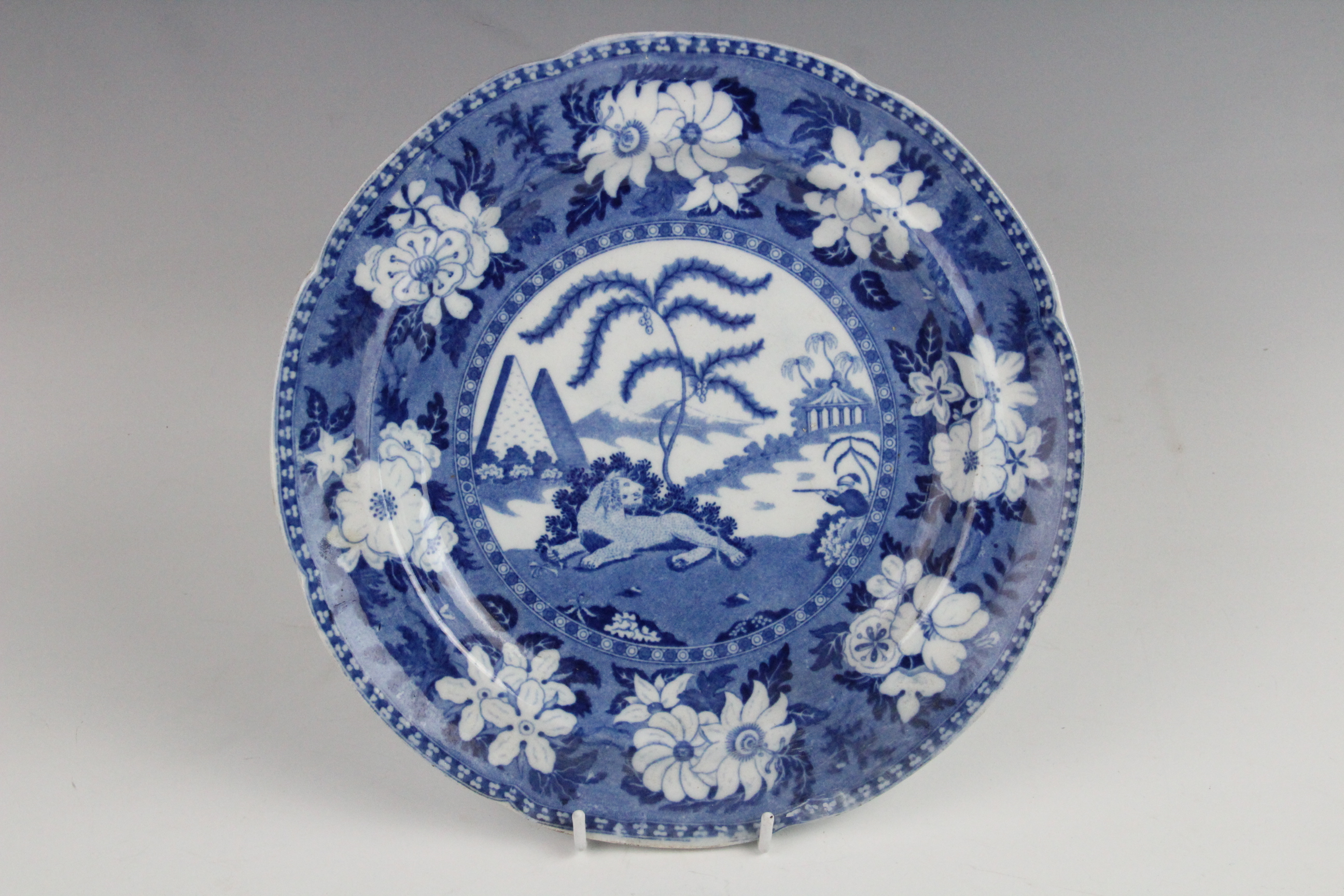 An Adams blue and white pearlware meat plate, 19th century, transfer printed with lions in a - Image 3 of 8