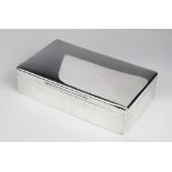 A silver cigarette box by George Henry Cowell, London 1919, of plain polished rectangular form
