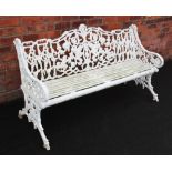 A Victorian painted cast iron Coalbrookdale style garden bench, the cast scrolling openwork