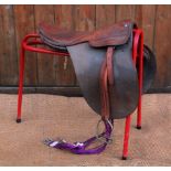 A vintage tan leather pony saddle, 4" wide, 18.5" seat (tree unchecked)
