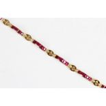 A ruby and diamond 18ct gold line bracelet, comprising eight panels each set with five square step