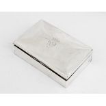 An Edwardian silver cigarette box by Marks & Cohen, Birmingham 1906, of rectangular form with hinged