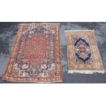 A 'Lapis' floral pattern rug, with a central royal blue ground and foliate motifs, 132cm x 91cm,