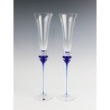Two Bohemian style oversize champagne flutes, 20th century, each with double knopped stem, in
