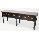 A 17th /early 18th century and later oak dresser base, the rectangular moulded three plank top top