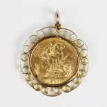 An Edwardian gold sovereign, dated 1907, set to a scrolling yellow metal pendant mount, weight 10.