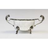 A George V twin-handled silver sugar bowl by E Hill, Birmingham 1934, of oval form with shaped