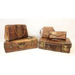 An early 20th century leather travel case, with outer leather straps and satin lined interior,