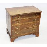 A 19th century honey oak chest of drawers, the rectangular moulded top above four oak lined