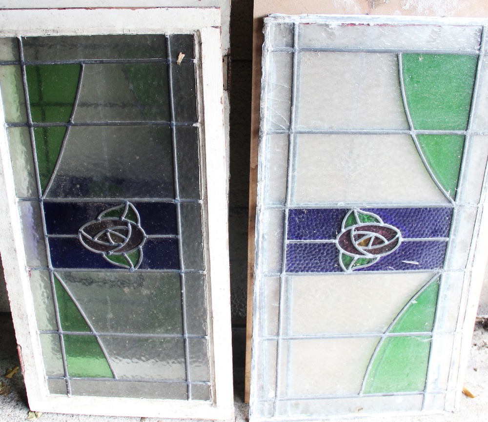 Six leaded glass window panels, 1920's/1930's, the rectangular panels centred with a coloured