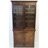 A George III mahogany library bookcase, the cavetto cornice above a pair of astragal glazed doors