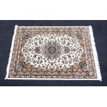 A cream ground fine wool rug, with an all over floral design, full pile, 220cm x 149cm