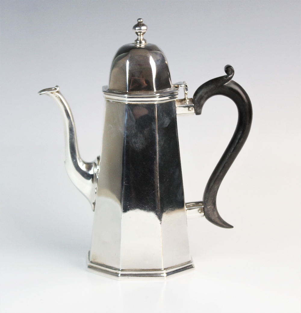 An Edwardian silver coffee pot by Charles Stuart Harris, London 1906, of tapered octagonal form,