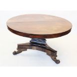A William IV rosewood centre table, the circular tilt top raised upon a triform pedestal and