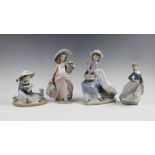Four Lladro figures, comprising: 05034 Goose Trying To Eat, 05469 Lambkins, 05212 Evita, 07676 A