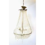 A gilt metal and glass droplet pendant light fitting, of swelling form, the lines of glass