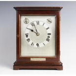 An early 20th century mahogany cased Westminster chime bracket clock, the 15cm silvered dial with