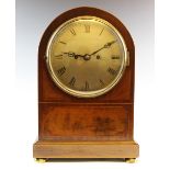 An early 20th century twin fusee mahogany cased bracket clock, the case of arched form with an