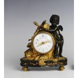 A late 19th century French gilt metal and spelter figural timepiece, the 6cm white enamel dial