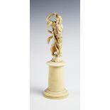 A 19th century carved ivory figure, modelled as a classical lady holding a cornucopia, 22cm high