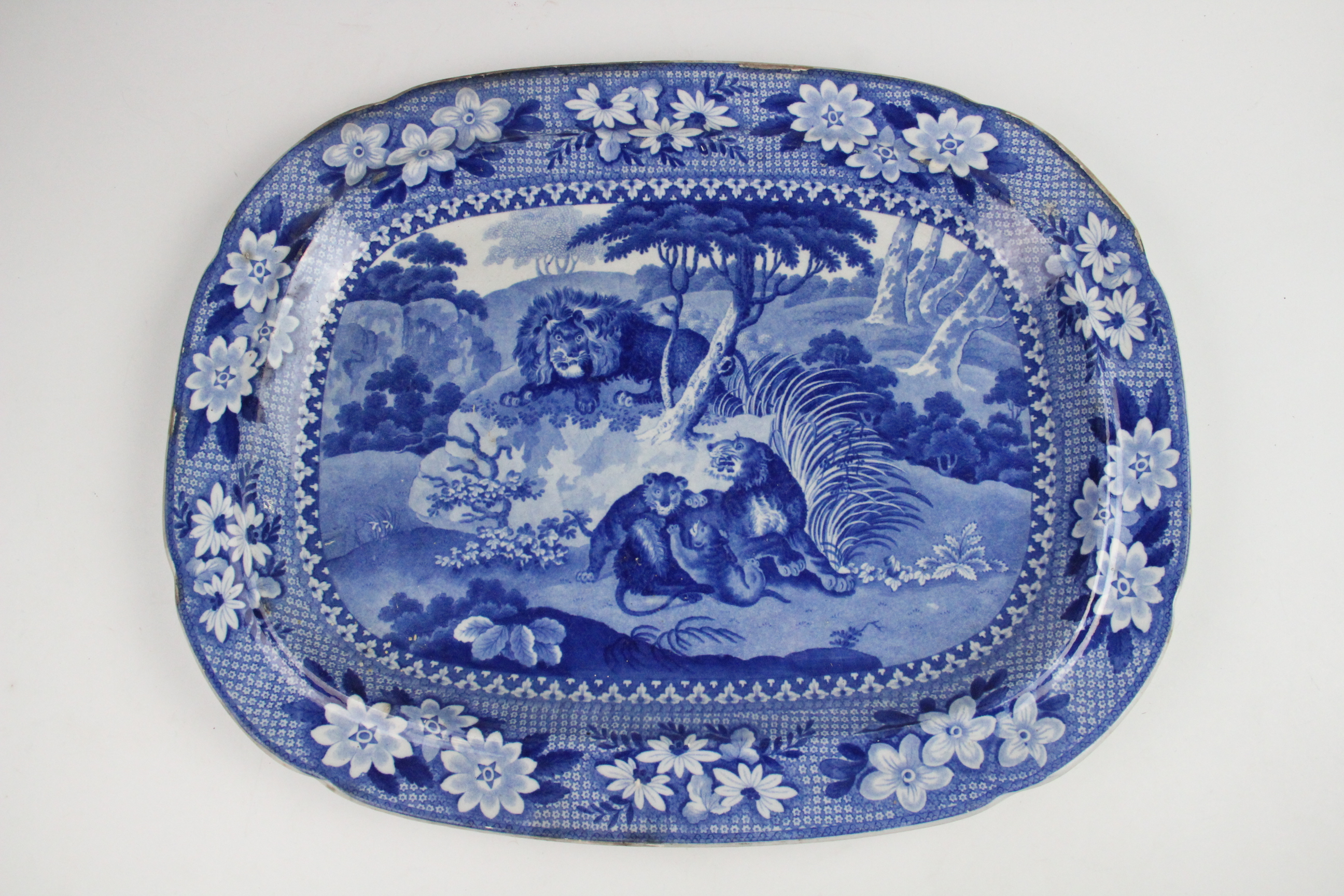 An Adams blue and white pearlware meat plate, 19th century, transfer printed with lions in a - Image 5 of 8
