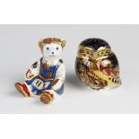 Two Royal Crown Derby paperweights, one modelled as a teddy bear with gold stopper, the other