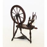 A late 18th/early 19th century Welsh oak spinning wheel, the ten spoke 53cm diameter wheel mounted