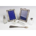 A pair of Edwardian silver mounted photograph frames by Henry Matthews, Birmingham 1903, each of