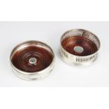 An Elizabeth II millennium hallmark silver and mahogany bottle coaster by M C Hersey & Son Ltd,