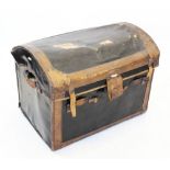 An early 20th century domed canvas and leather trunk, applied with leather banding and straps,