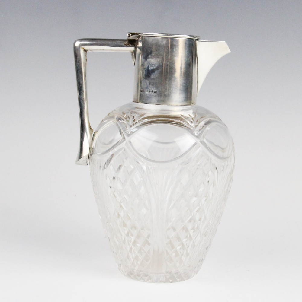 A George V silver mounted cut glass claret jug by John Grinsell & Sons, Birmingham 1911, of baluster