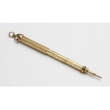 A Victorian mechanical propelling pencil by Sampson Mordan, the yellow metal pencil with reeded
